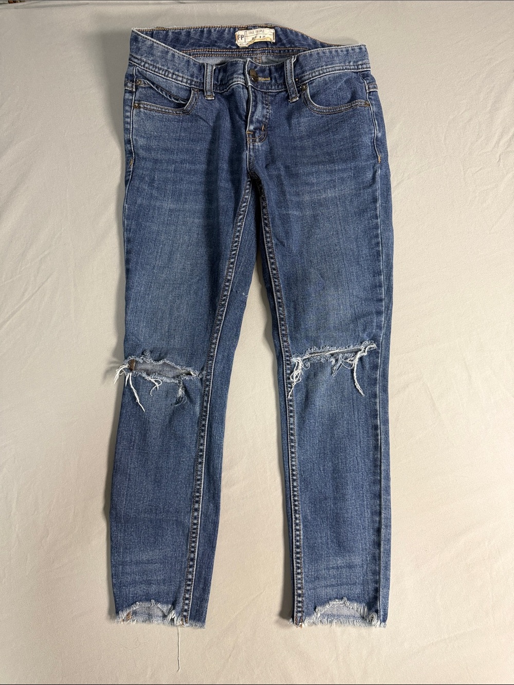 Free People Distressed Blue Skinny Jeans with Knee Rips
